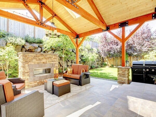 Average outdoor living space as a covered patio with a fireplace