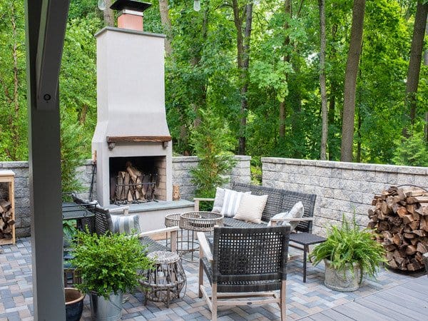 Patio with stone walls and fireplace