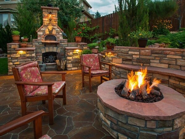 Firepit and fireplace in an outdoor living space
