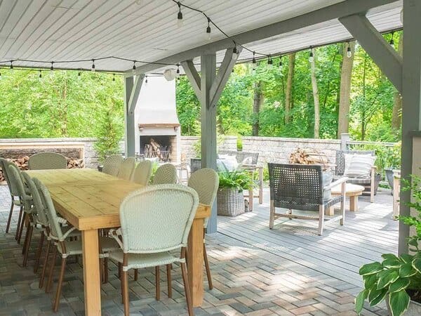 Patio with covered deck above it and deck beside it