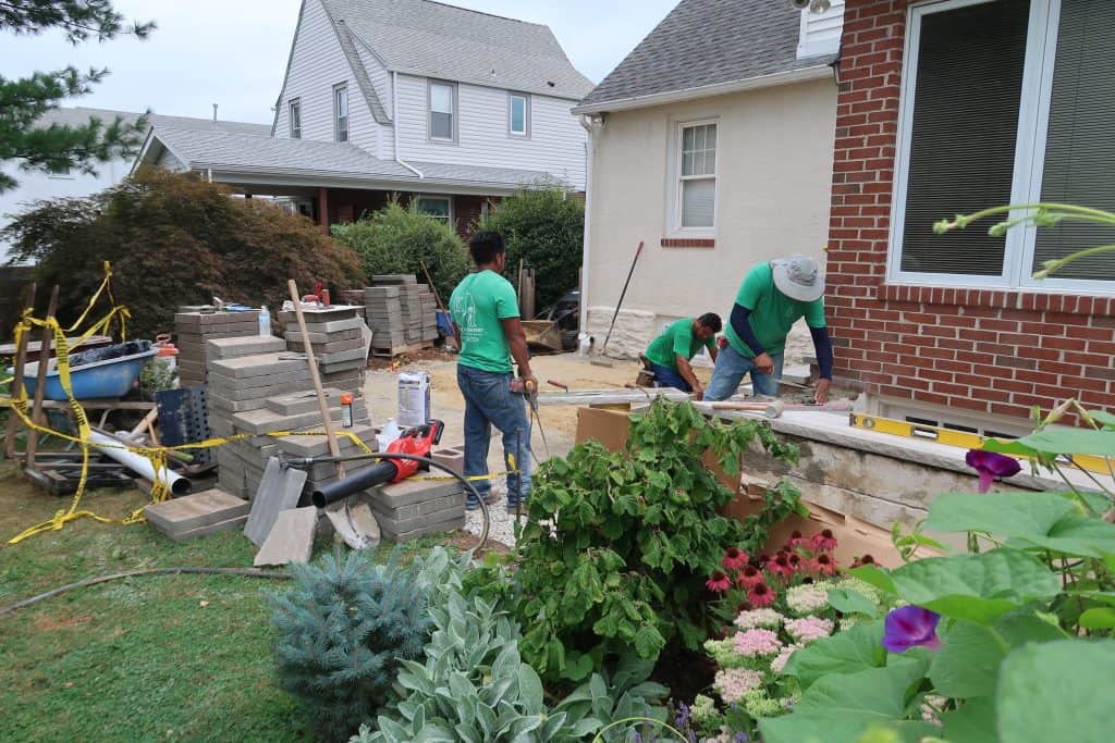 Kelly Masonry team installing a patio.