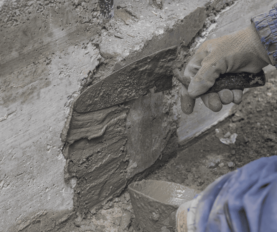 Mason parging a cement-block wall