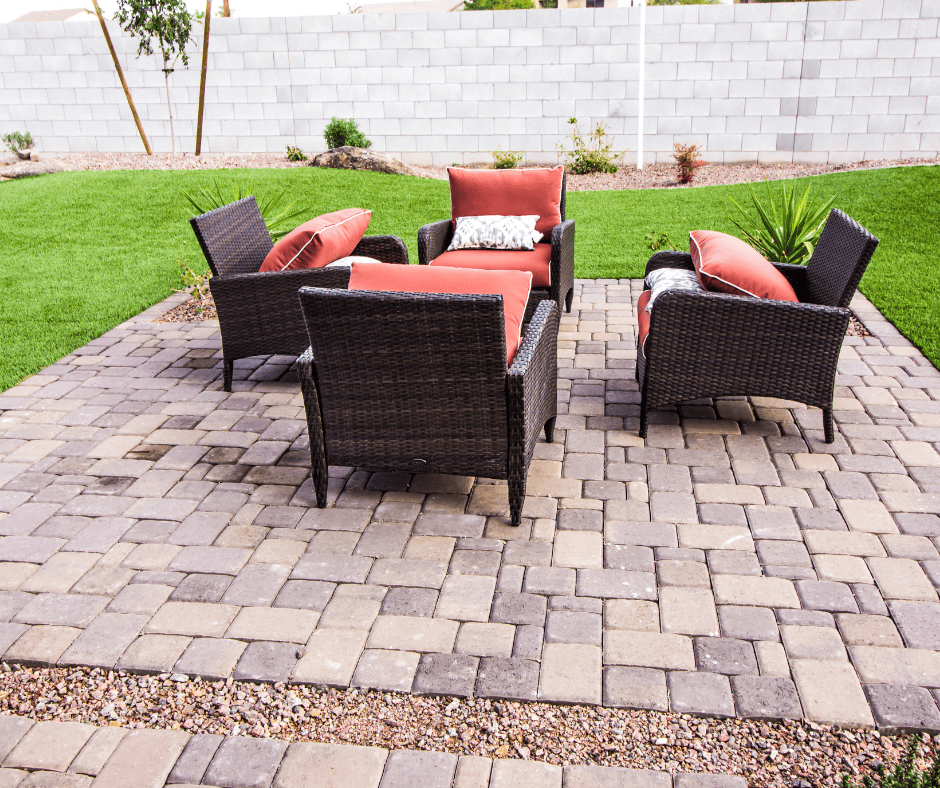 A backyard with a paver patio