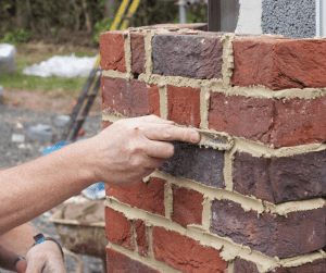 Man pointing brick
