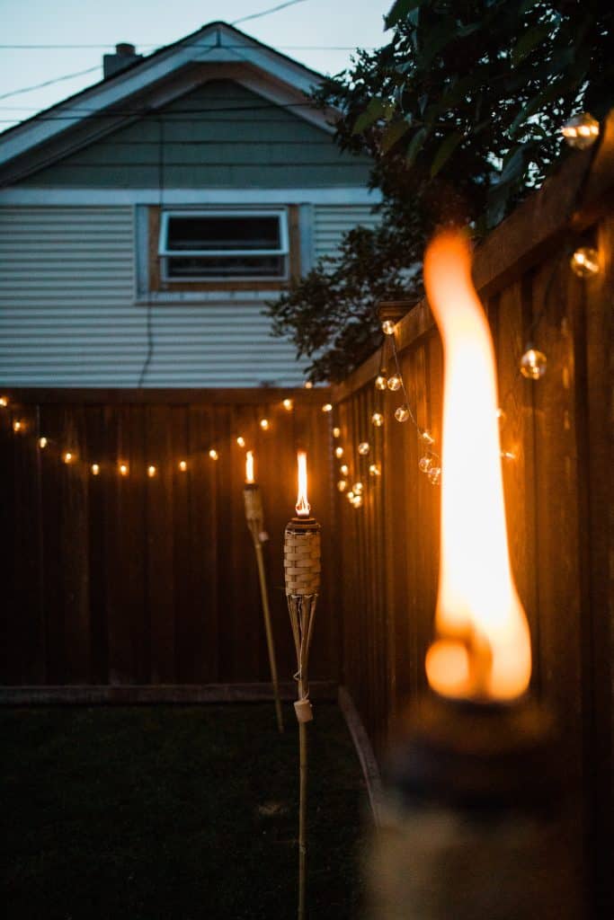 Backyard lighting options include lanterns and torches