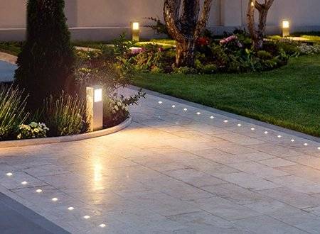 Several types of landscape lighting in yard