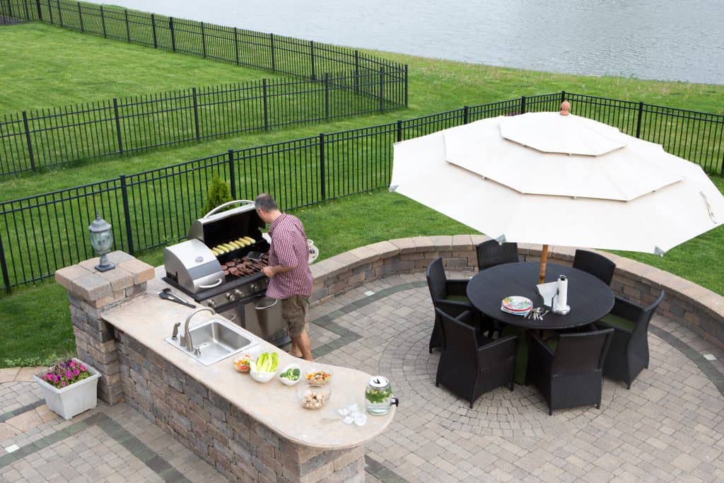 Paver patio with grill and sink area.