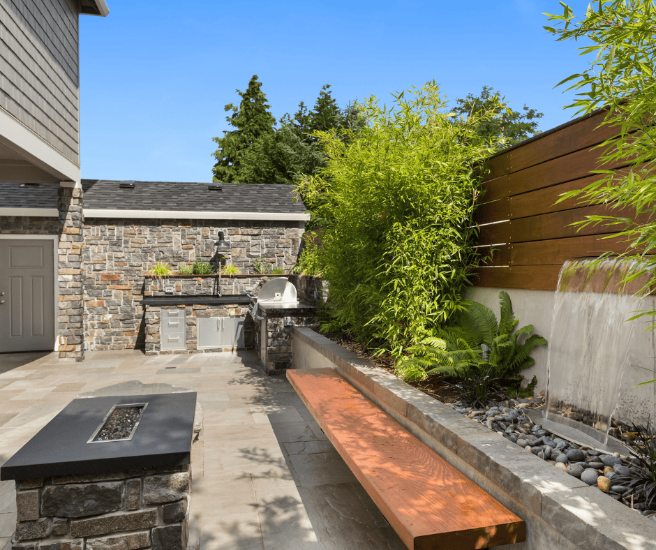 Small backyard with water feature and outdoor kitchen