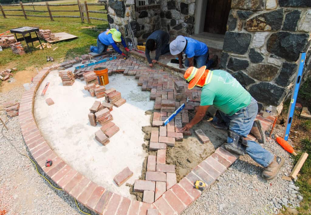 Old reused brick in herringbone pattern patio