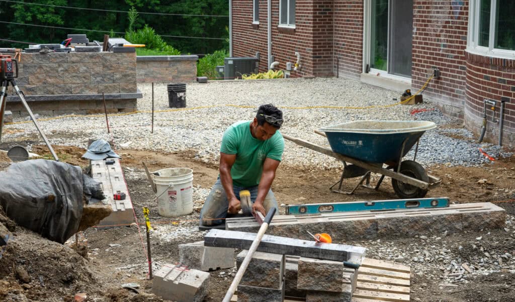 Mason completing a patio project