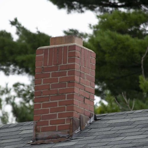 Damage to asphalt and asbestos shingles, gutter systems, chimney and roof flashing on residential home